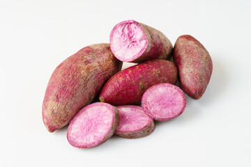 Fototapeta premium Fresh purple sweet potato on white background