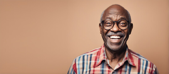 Fototapeta premium Smiling elderly Black man on plain background