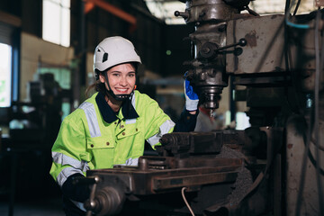 Portrait of  Engineer inspecting and check up machine at factory machines. Industrial worker working and checking Material or Machine at industry manufactory.