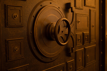 Closed steel bank vault door, close-up. Bank vault. Safe storage of valuables - obrazy, fototapety, plakaty