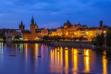 Prague medieval architecture and Vltava river at night, Czech Republic.