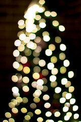 Garland bokeh on a Christmas tree. Christmas atmosphere