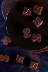 Handmade chocolate with pistachios, dark and milk chocolate pieces.
