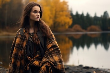 beautiful Scottish woman wearing old fashion plaid coat with autumn forest and lake as background, Generative Ai