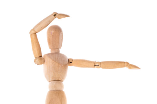 A wooden mannequin with its arms extended outward. This versatile image can be used to represent concepts such as creativity, freedom, teamwork, or meditation.