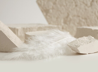 Empty stack of stones platform podium on light beige background. Minimal empty display product presentation scene.