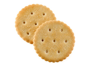 Healthy whole wheat cracker on white background. Stack of Saltine crackers isolated on white background. Round crackers.
