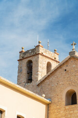 Fototapeta premium Beautiful church and bell tower in the old town, in Alalà de la Jovada, Alicante (Spain)