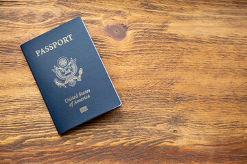 Passport on wooden table background - obrazy, fototapety, plakaty