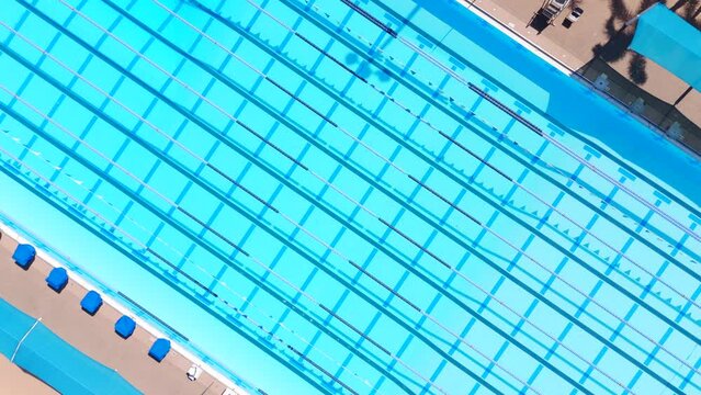 Aerial spin over a swimming pool 4k