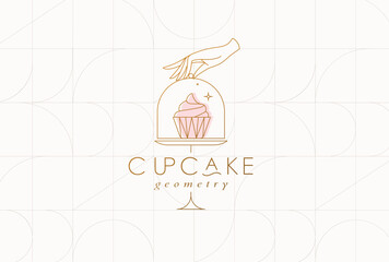 Cake stand with cupcake in art deco style holding by hand drawing on beige background