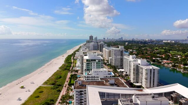Miami stock footage circa 2023 October. View of ocean condominiums and walking path along dunes