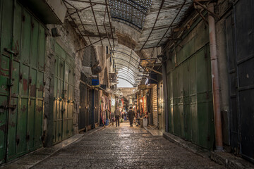 The local people and small stores are on the streets of Muslim Quarter in Jerusalem Old City,...