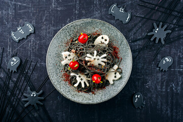 Traditional Halloween octopus spaghetti with Dracula spiders, bats and blood-dripping tomatoes...