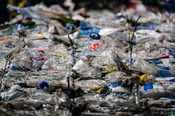 Detail hundreds of plastic containers ready to be recycled