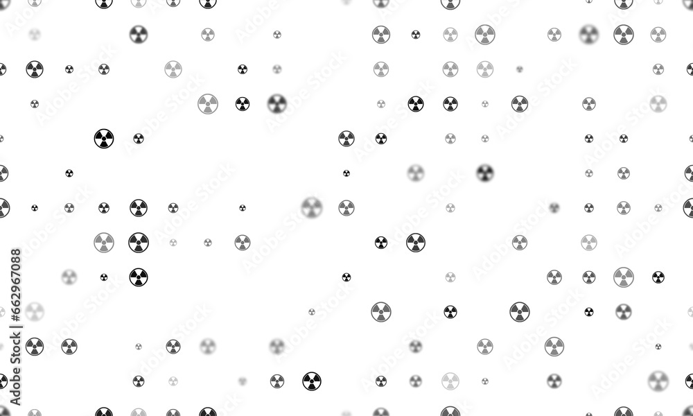 Poster seamless background pattern of evenly spaced black radiation symbols of different sizes and opacity.