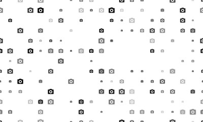 Seamless background pattern of evenly spaced black photo camera symbols of different sizes and opacity. Vector illustration on white background