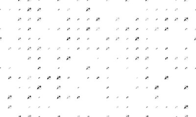 Seamless background pattern of evenly spaced black fireworks symbols of different sizes and opacity. Vector illustration on white background