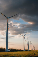 Wind electricity generator in summer fields, power plant, wind efficiency	