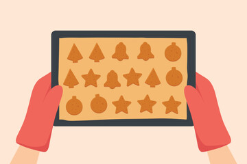 hands holding a baking tray with homemade christmas gingerbread cookies -vector illustration