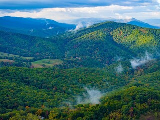 Aerial view of the Appalachian Mountains with lush vegetation and clouds