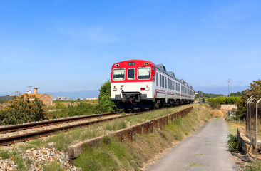 Train on railway. Spain regional commuter train in motion on railway. Spanish National Rail...