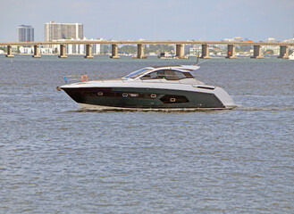 Upscale cabin cruiser on the Florida `intra-Coastal Waterway near Miami Beach .