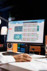 Image showcasing a pc monitor displaying statistics and data for a startup company. Detailed shot...