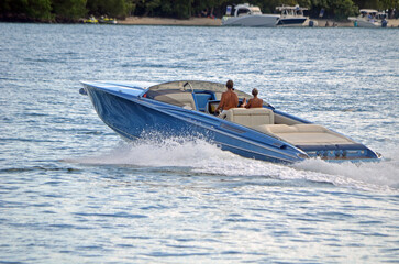 Upscale motorboat speeding on the `intra-Coastal Waterway near Miami Beach ,Florida.