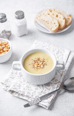 Obraz na płótnie Canvas White beans rosemary potato soup in a bowl