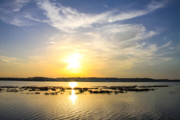 Peaceful landscape with lake in autumn sunset light in Latvia.