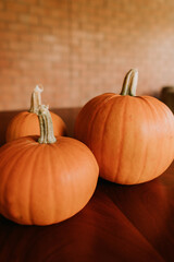 Three pumpkins on a table