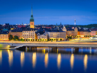 Fototapeta na wymiar Stockholm, Sweden. Panoramic view of the Gamla Stan. The capital of Sweden. Cityscape during the blue hour. View of the old town in Stockholm. Large resolution photo for background and wallpaper.