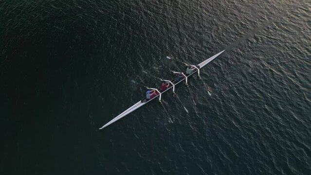 Aerial View Quadruple Scull Boat with four Rowers Prepares to Compete in a Race 