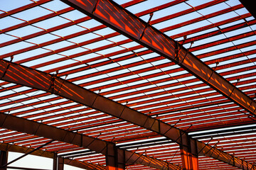 Heavy steel I beams provide strong support for a new commercial building under construction.