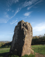 A large rock in a field used as an ancient ceremony monument