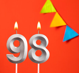Birthday candle number 98 - Invitation card in orange background
