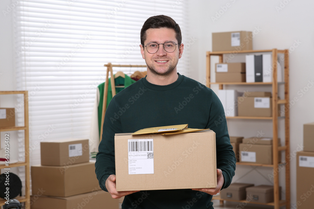 Poster Seller with parcels in office. Online store