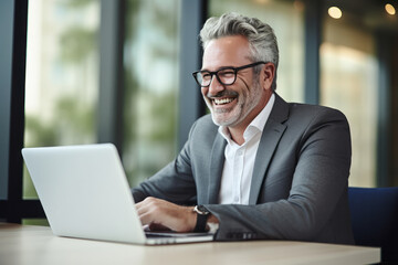Fototapeta premium Mature Businessman Engages in Virtual Meeting
