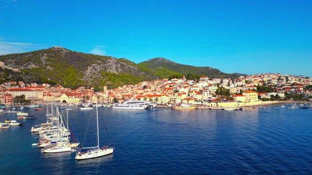 Aerial drone view of Hvar, Croatia during the daytime in the harbor.