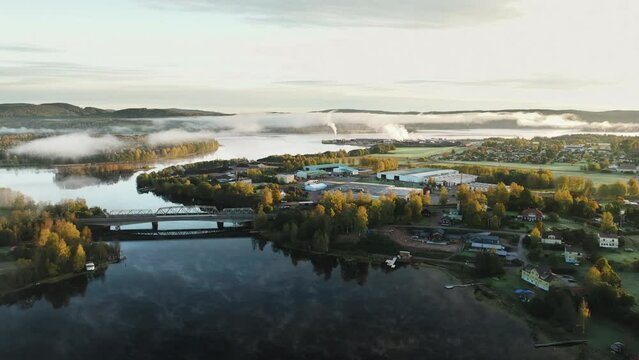 A foggy river close to a city