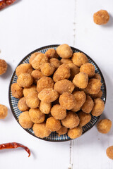 flavored peanuts or crunchy Peanut in a plate on table.