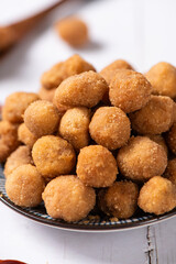 flavored peanuts or crunchy Peanut in a plate on table.