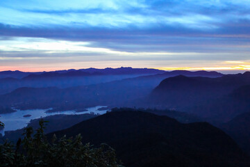 The lake surrounded by the morning mist at the Little Adam's Peak, Sri Lanka