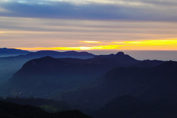 The sunrise sky and the morning mist at the Adam's Peak, Sri Lanka