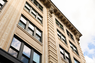 cityscape at sunset, featuring sleek modern buildings, a symphony of light, and urban life, evoking a sense of progress and dynamism