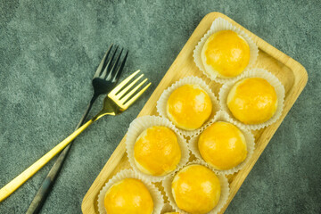 Close up of Moon cake yolk pastry on wood tray