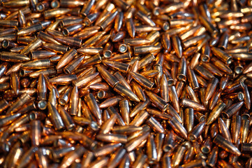 Glowing large caliber bullet heap for riffle as background