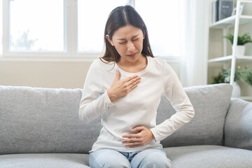 Acid reflux disease, suffer asian young woman have symptom gastroesophageal, esophageal, stomach...