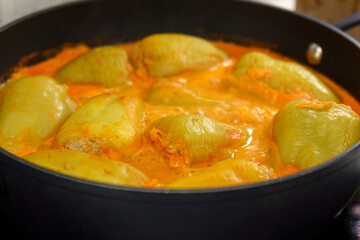 Bell peppers stuffed with meat, rice and sauce on selective focus. Cooking homemade food